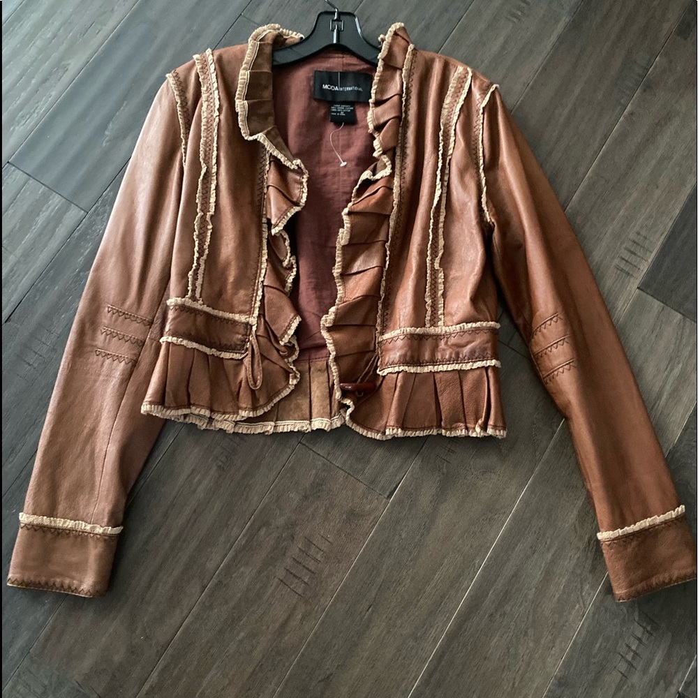 Leather peplum jacket in excellent condition